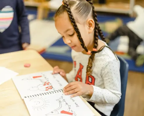 Montessori math materials being used to explore abstract concepts