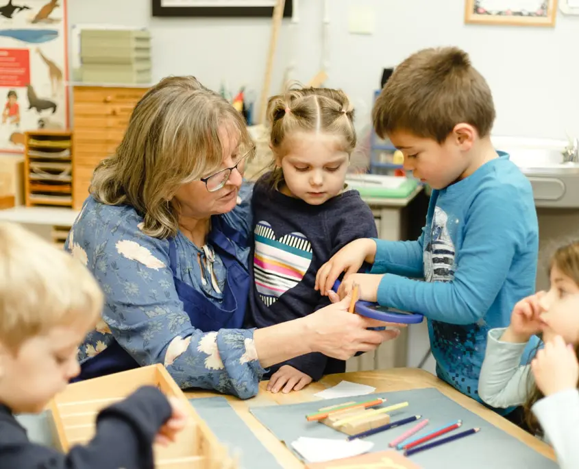 children engaged in cleaning up the classroom, fostering responsibility